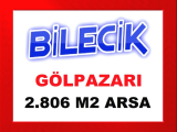 bilecik gölpazarı nda asfalt yolu olan çevresinde sera ve çiftlikler olan ekilip biçilebilir 2.806 m2 